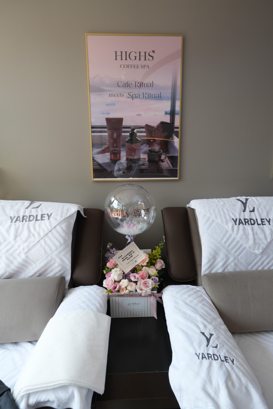 Side-by-side recliners set with Yardley towels and flowers