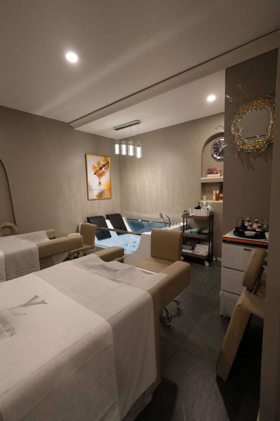 Private suite with a soaking tub and treatment bed