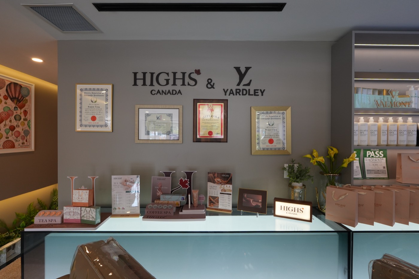 Reception counter beneath the Highs & Yardley wall
