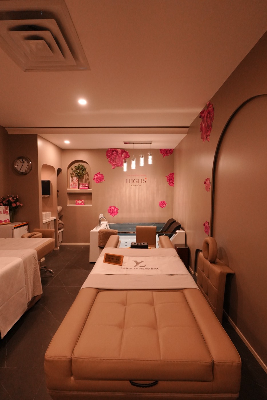 A private treatment suite with soft lighting and floral detail